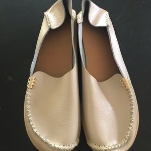 Cream/beige colored slip on shoes